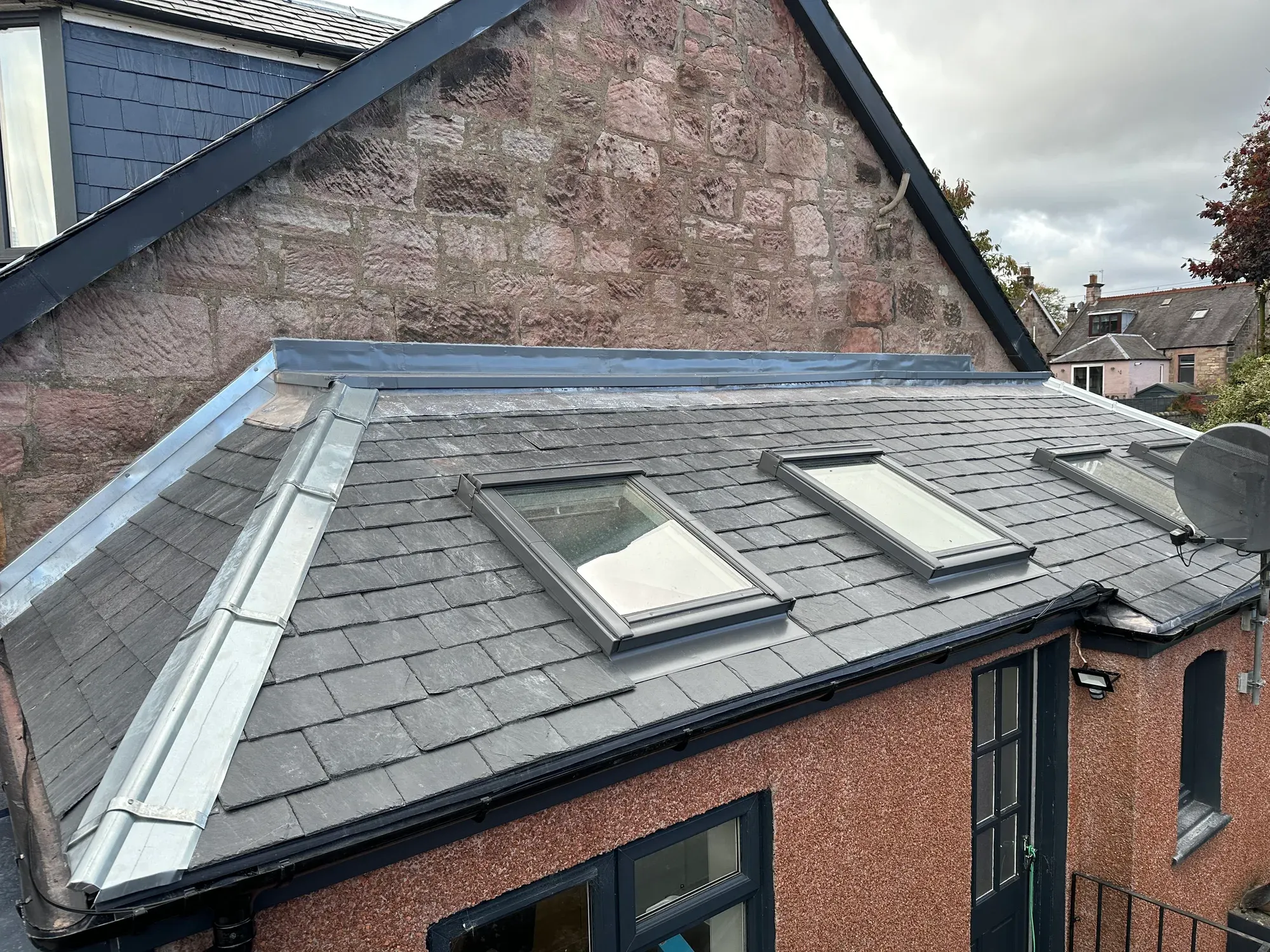 Roof windows cut into a stone villa