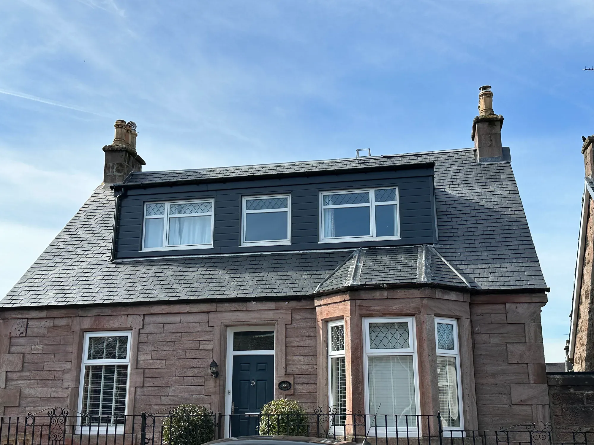 Slate roof and dormer work completed on a sandstone villa